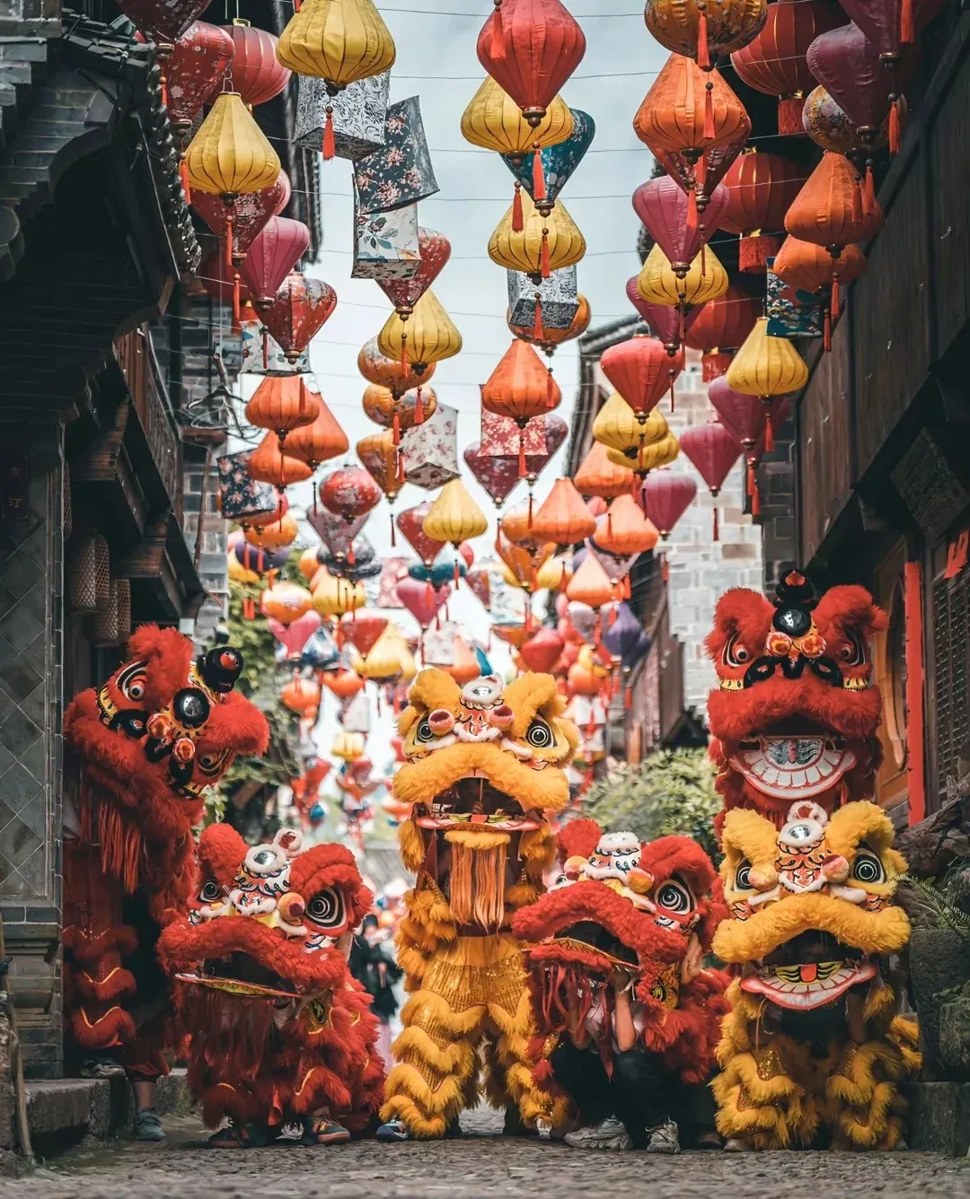 Traditional Chinese folk performers in ceremonial costumes